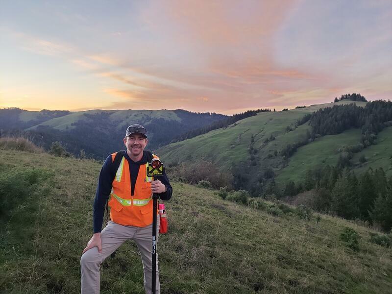 scenic image from shasta land surveying on the job with a sunset