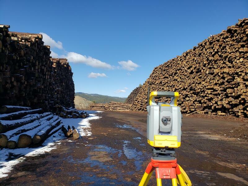 image from shasta land surveying on the job surveying a timber yard